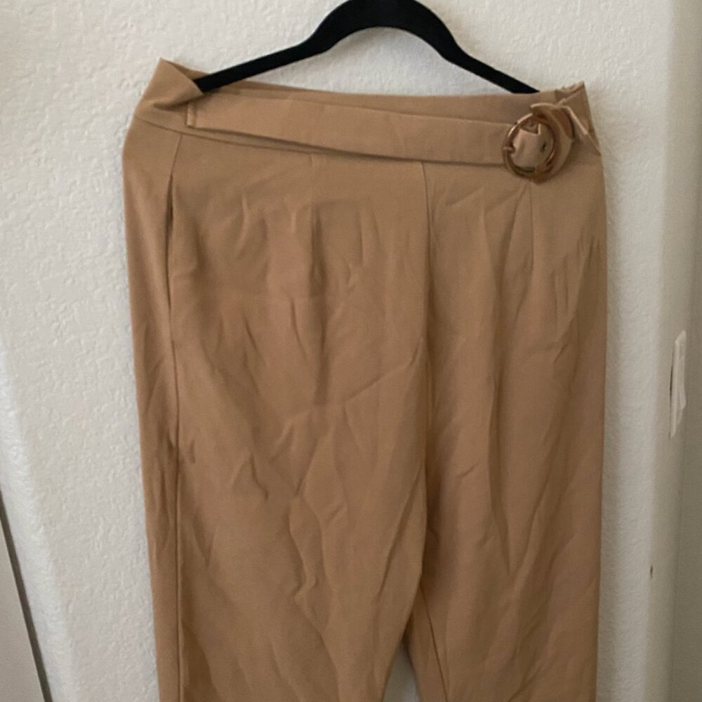 light brown trousers with gold buckle